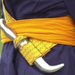 Why do Sikhs carry swords with them?